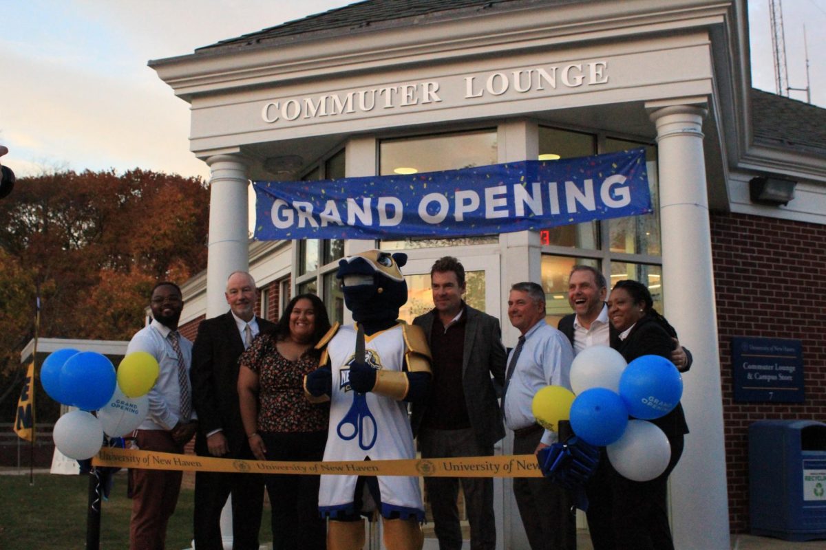 University leaders pose before the ribbon cutting of the new commuter lounge