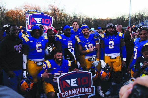 New Haven football players after clinching the program's sixth NE10 title