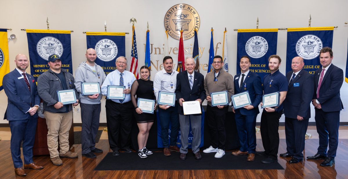 Veterans and recipients of honorary degrees in the Alumni Lounge,