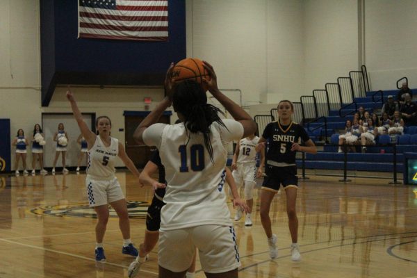 #10 Aniya McDonald-Perry with the ball against SNHU