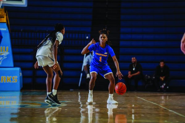 Rennelle Grannum dribbling the ball.
