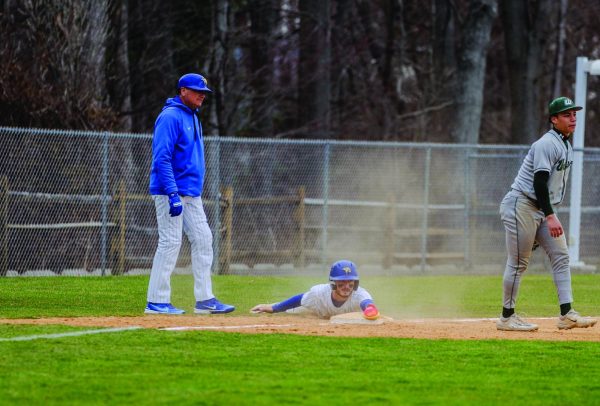 Nick Ungania sliding into third base. 
