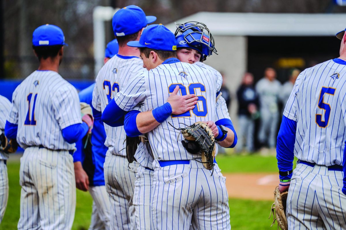 Chargers hug in the lineup before the game.
