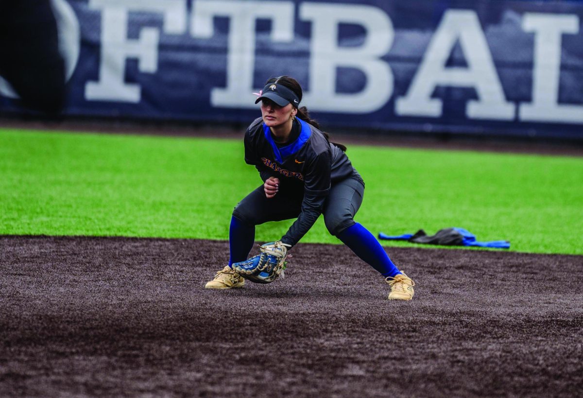 Corina Wilton playing infield. 

