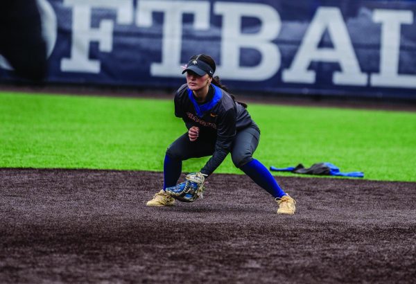 Corina Wilton playing infield. 
