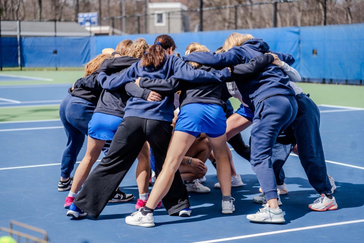 Chargers huddle before their matches began. 
